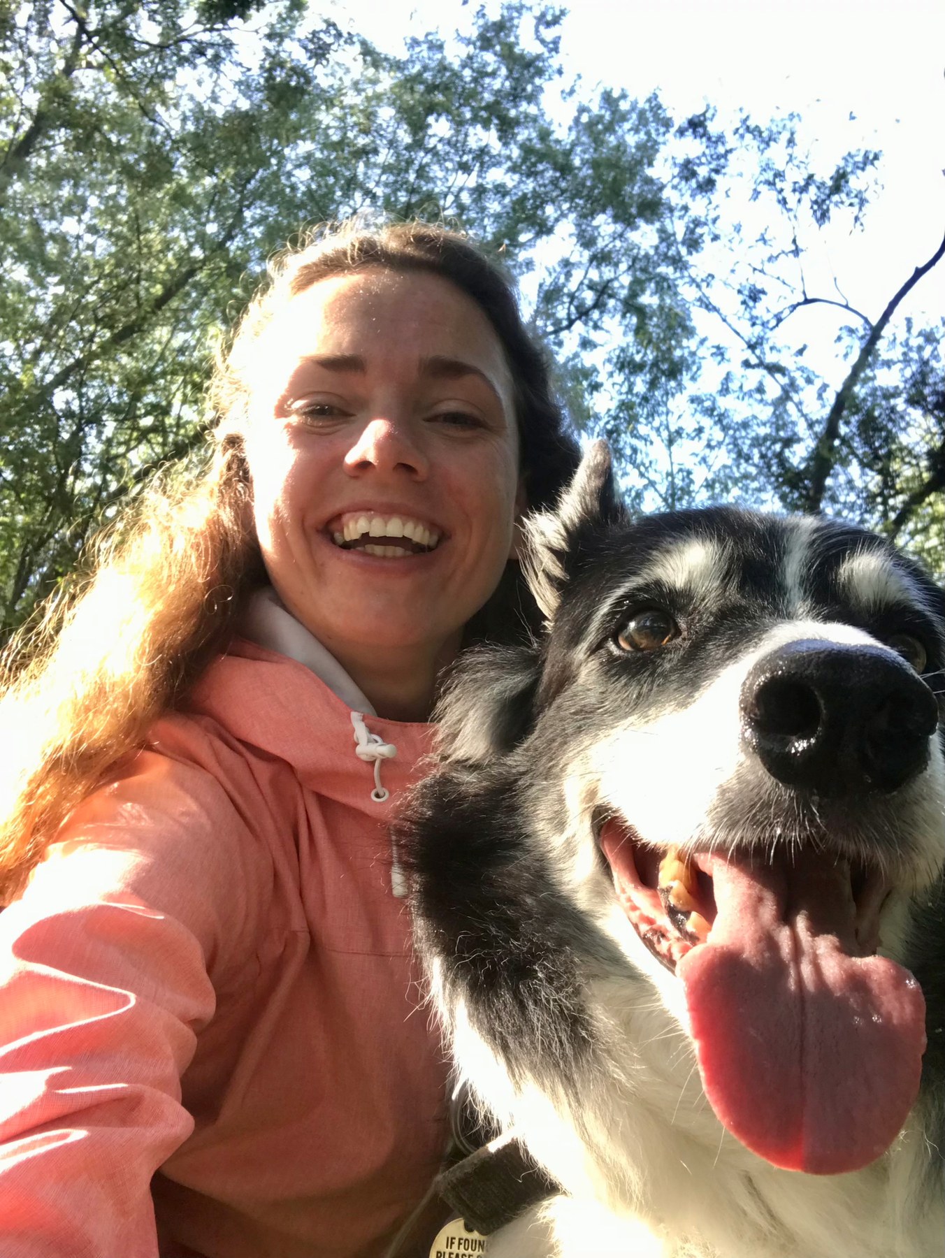 Monika outdoors with Silas, a happy black-and-white collie